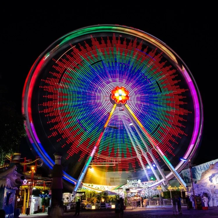 A long exposure of a Ferris wheel shot with a DSLR. We&rsquo;ll apply the same technique to iPhone photography